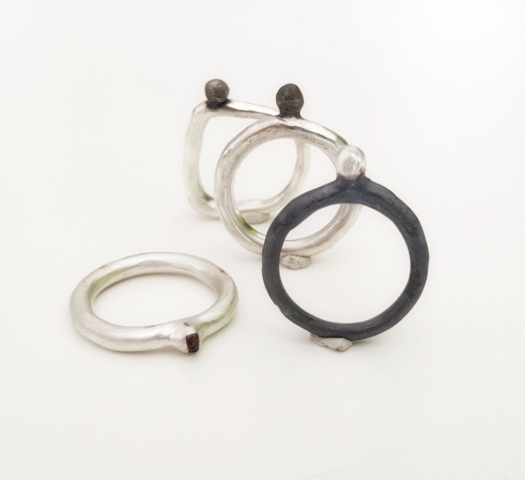 stack of sterling silver lost wax cast rings